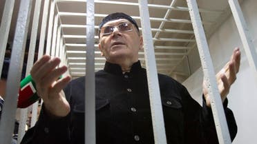 Oyub Titiev behind bars in a court after a hearing in Shali, Russia, on March 18, 2019. (AP)