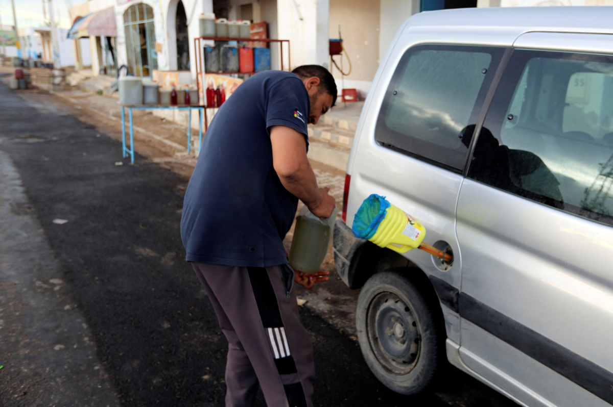 A men fills a vehicle with gasoline in Ben Guerdane, near the Libyan border in Tunisia. (Rueters)