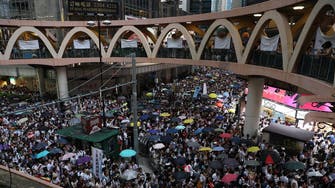 Hong Kong protesters take aim at Chinese visitors to explain grievances