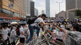 Hong Kong leader suspends China extradition bill, says sorry