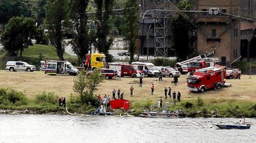 Rescue team work at the scene of the accident after a pilot of a stunt plane plunged into the Vistula River during the Air Picnic in Plock, Poland, on June 15, 2019. (Reuters)