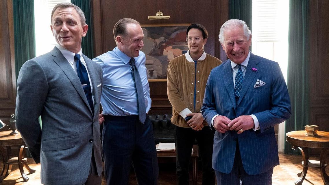 Prince Charles poses with Daniel Craig, Ralph Fiennes and US Director Cary Joji Fukunaga as he tours the set of the 25th James Bond Film at Pinewood Studios in Iver Heath, Buckinghamshire, Britain June 20, 2019. (Reuters)