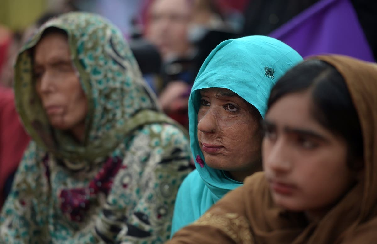 Pakistani acid victims take along with civil society activists during a march for women rights on International Women's Day in Islamabad on March 8, 2019. (AFP)