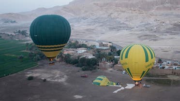 A general view shows the hot air balloon (L) that exploded and plunged to earth, amongst others balloons leaving a launch site near Egypt's ancient temple city of Luxor. (File photo: AFP)