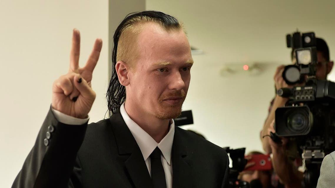 Ola Bini, a Swedish national accused of an alleged cyber-attack and who is close to WikiLeaks founder Julian Assange, gestures before the appeal hearing to his order of preventive detention, at the Provincial Court of Pichincha in Quito, on May 2, 2019.