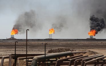 Flames emerge from the flare stacks at the West Qurna-1 oilfield, which is operated by ExxonMobil, near Basra, Iraq June 1, 2019. (Reuters)