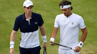 Murray marks return with doubles win