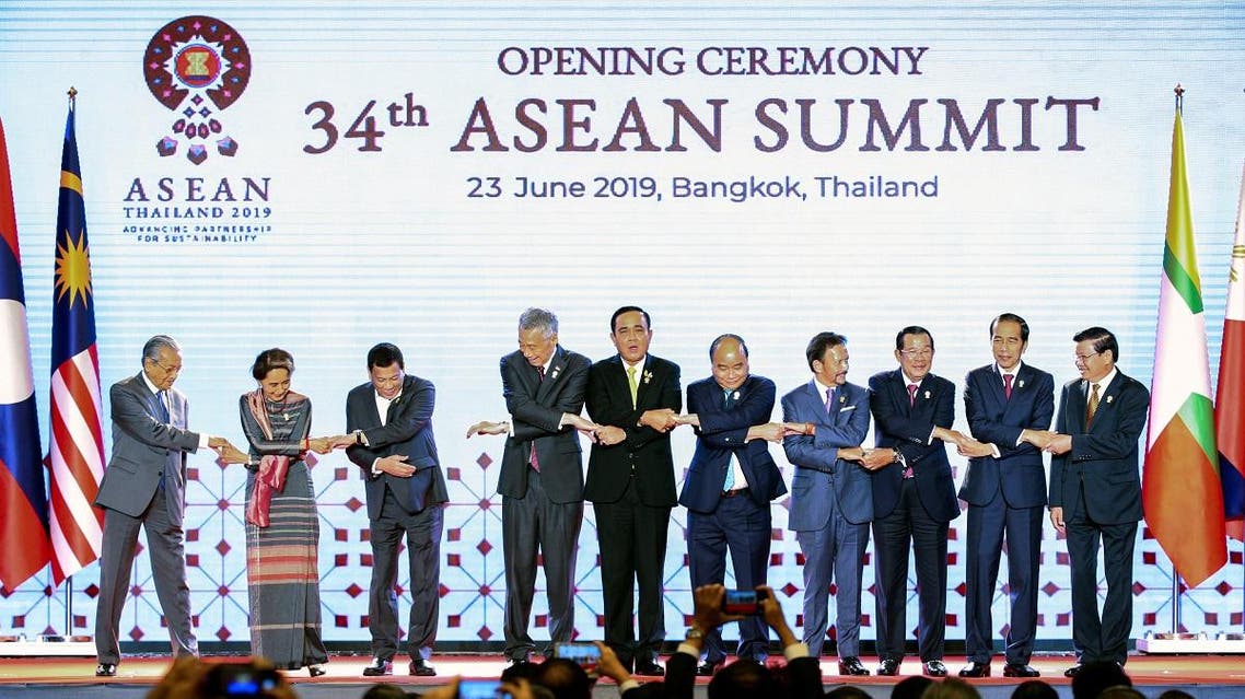 ASEAN leaders shake hands on stage during the opening ceremony of the 34th ASEAN Summit at the Athenee Hotel in Bangkok. (Reuters)