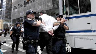 Climate change protesters arrested outside the New York Times building