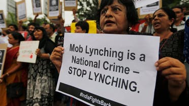 Indians hold placards and shout slogans during a protest against mob attacks in Ahmadabad on July 23, 2018. (File Photo: AP)