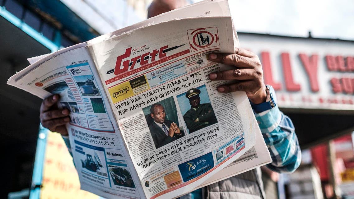 A man reads the Ethiopian newspaper depicting the portraits of killed Ambachew Mekonen, President of the Ahmara Region, and of Gen. Sere Mekonen, Chief of Staff of the Ethiopian National Forces, in Addis Ababa, on June 24, 2019. (AFP)