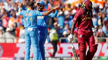 India’s Mohammed Shami celebrates with Virat Kohli after taking the wicket of West Indies’ Shimron Hetmyer in the ICC Cricket World Cup match at Old Trafford, Manchester, Britain, on June 27, 2019. (Reuters)