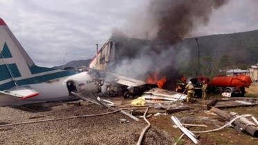 An Antonov An-24 passenger plane is seen on fire after an emergency landing in the town of Nizhneangarsk, Russia June 27, 2019. (Reuters)