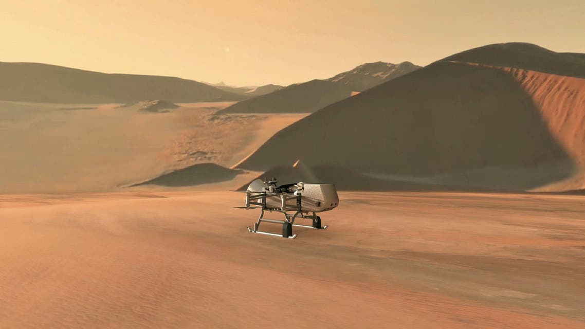 This NASA artist’s illustration released on June 27, 2019, shows NASA’s Dragonfly rotorcraft-lander approaching a site on Saturn’s exotic moon, Titan. (AFP