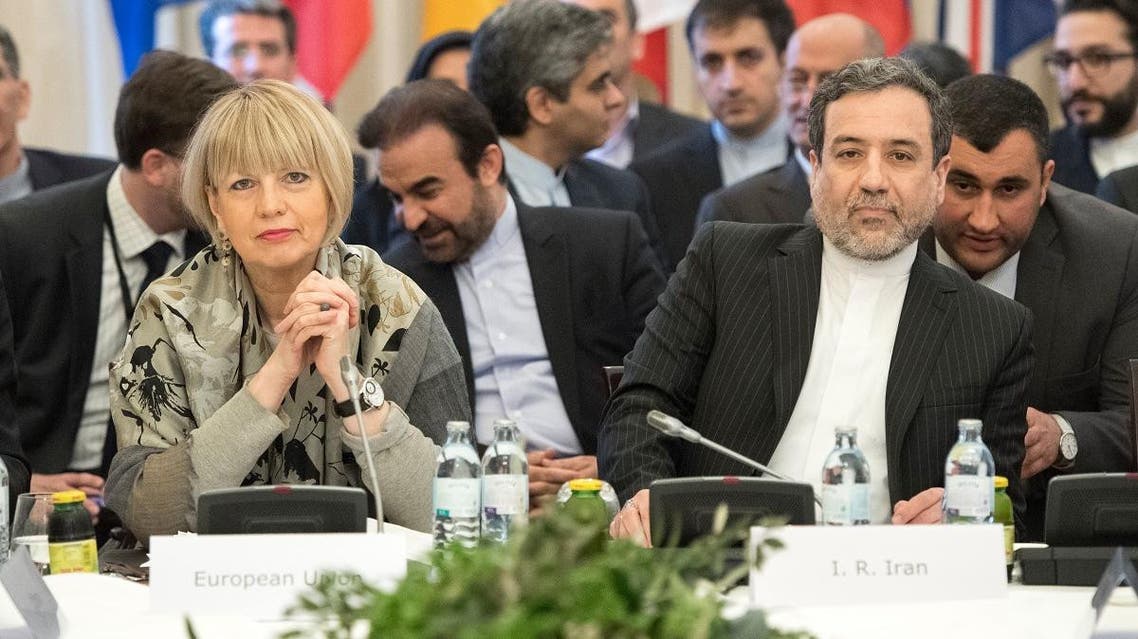 Abbas Araghchi (R), political deputy at the Ministry of Foreign Affairs of Iran, and the Secretary General of the European Union External Action Service (EEAS) Helga Schmid attend E3/EU+3 and Iran talks at Palais Coburg in Vienna, Austria on March 16, 2018. (File photo: AFP)