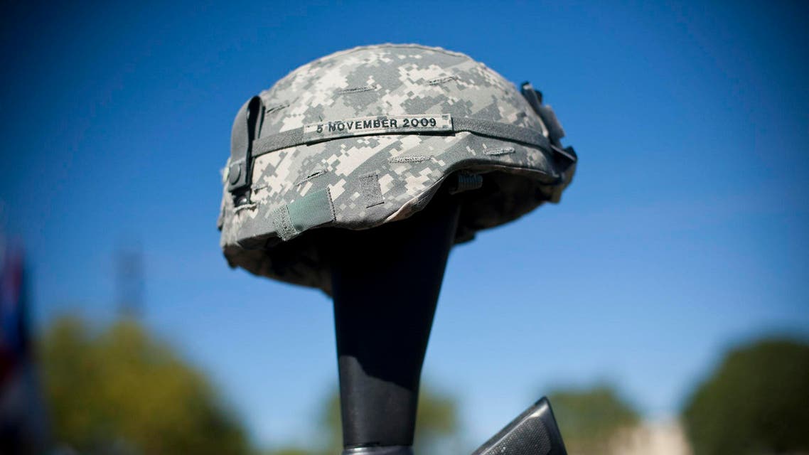 The soldiers memorial reads the date November 5, 2009 at a remembrance service recognizing the 13 victims killed in the Ft. Hood attacks on the one year anniversary in Killeen, Texas on November 5, 2010. (AFP)