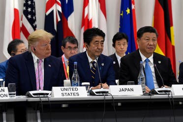Chinese President Xi Jinping (right)speaks at the G-20 summit event on the Digital Economy in Osaka, Japan, on June 28, 2019. President Donald Trump and Japanese Prime Minister Shinzo Abe listen. (AP)