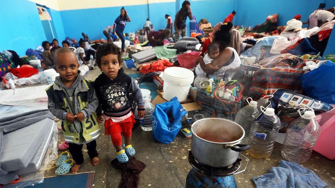 African migrants who fled battle zones in Libya gather at a detention center in Zawiya, west of the capital Tripoli, on April 27, 2019. (AFP)