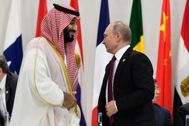 Saudi Arabia’s Crown Prince Mohammed bin Salman and Russian President Vladimir Putin arrive for a working session of leaders at the G-20 summit in Osaka, Japan. (AP)