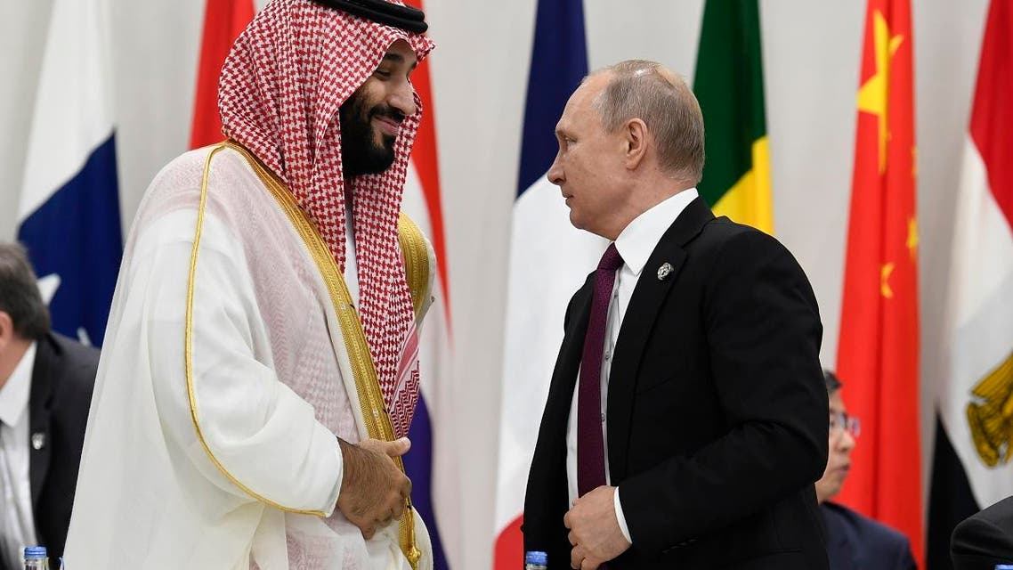 Saudi Arabia’s Crown Prince Mohammed bin Salman and Russian President Vladimir Putin arrive for a working session of leaders at the G-20 summit in Osaka, Japan. (AP)