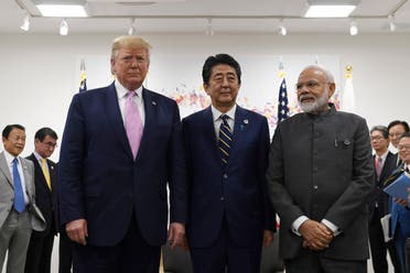President Donald Trump, Japanese Prime Minister Shinzo Abe, , and Indian Prime Minister Narendra Modi, pose for a group photo at the start of their meeting on the sidelines of the G-20 summit in Osaka, Japan, on June 28, 2019. (AP)