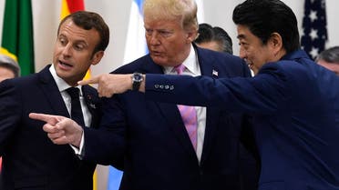 French President Emmanuel Macron, President Donald Trump with Japanese Prime Minister Shinzo Abe before a working session at the G-20 summit in Osaka, Japan, on June 28, 2019. (AP)