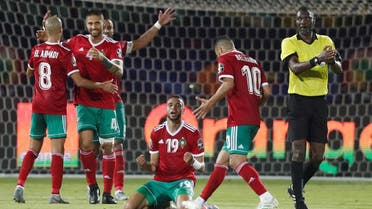 Morocco's Youssef En-Nesyri celebrates with team mates after the match. (Reuters)