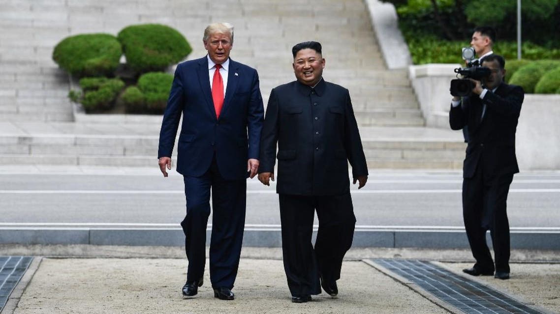US President Donald Trump meets with North Korean leader Kim Jong Un at the DMZ separating the two Koreas, in Panmunjom. (AFP)