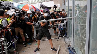 Protesters try to break into the Legislative Council building where riot police are seen, during the anniversary of Hong Kong's handover to China in Hong Kong. (Reuters)