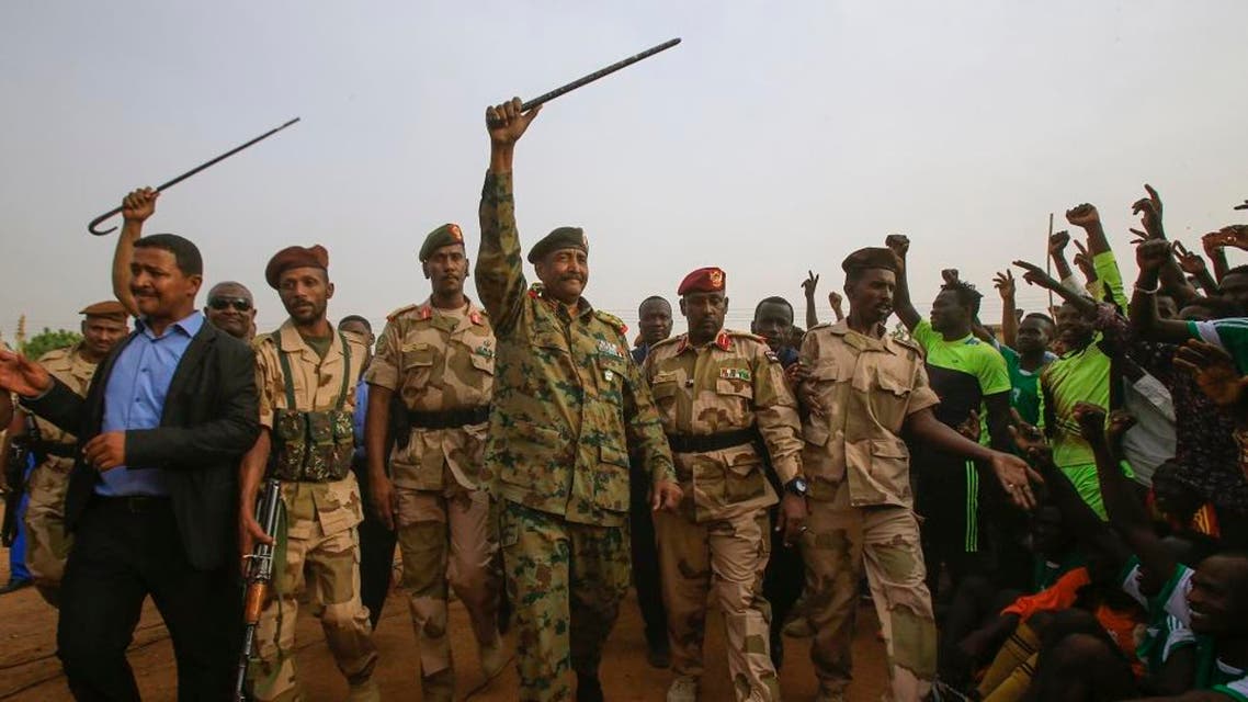 General Abdel Fattah al-Burhan, the head of Sudan's ruling military council, greets his supporters in Khartoum's twin city of Omdurman. afp