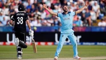 England’s Mark Wood celebrates the dismissal of New Zealand’s Mitchell Santner. (Reuters)