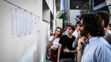 Students check the results of the baccalaureat exam (high school graduation exam) at the Fresnel high school in Paris. (AFP)