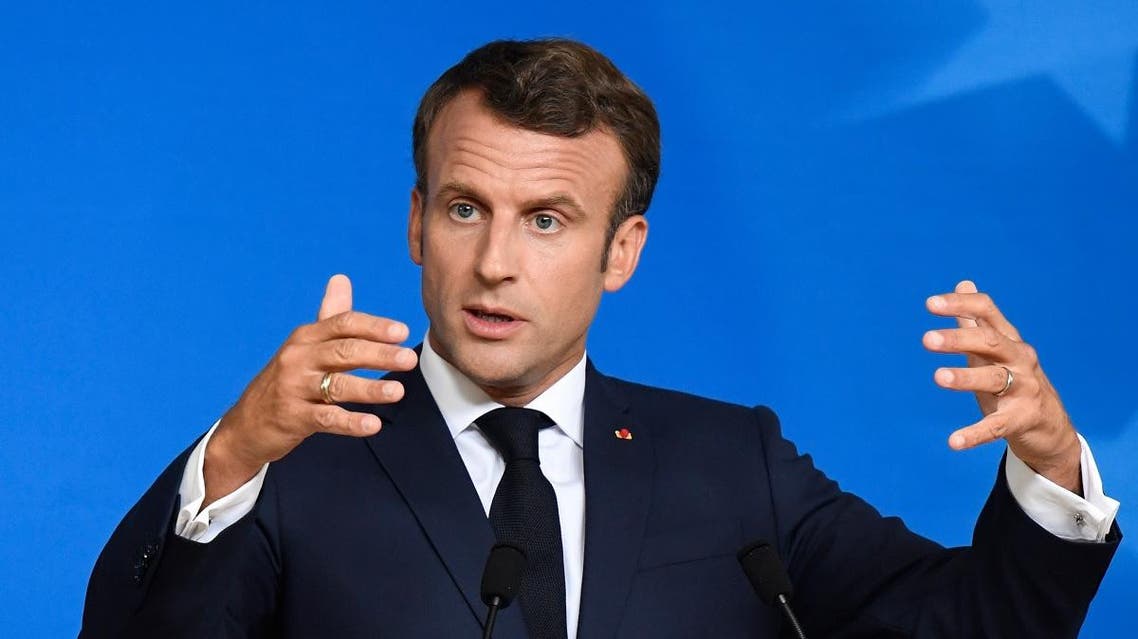 France's President Emmanuel Macron gestures as he addresses the media. (AFP)