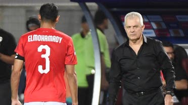 Egypt's coach Javier Aguirre (R) speaks with Egypt's defender Ahmed Elmohamady during the 2019 Africa Cup of Nations (CAN) Round of 16 football match between Egypt and South Africa at the Cairo International Stadium in the Egyptian Capital on July 6, 2019. (AFP)