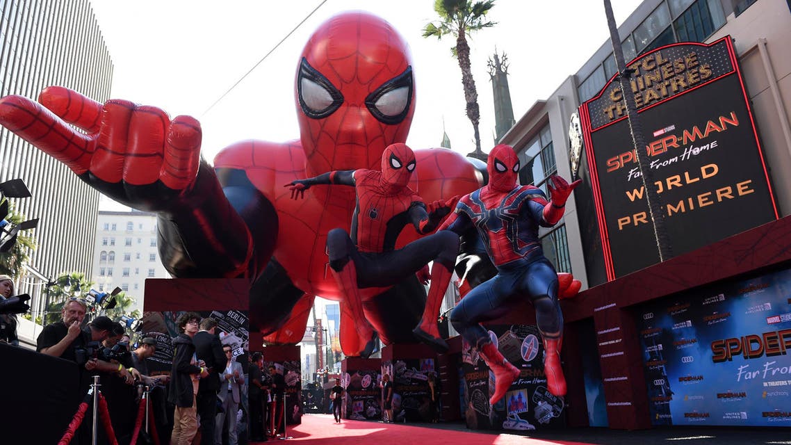 Two Spider-Man characters jump in front of a Spider-Man float at the world premiere of "Spider-Man: Far From Home" on Wednesday, June 26, 2019, at the TCL Chinese Theatre in Los Angeles. (AP)