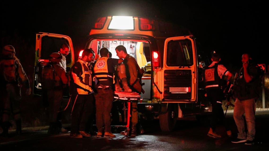Israeli medics evacuate soldiers who were wounded in an alleged car-ramming attack near the Palestinian town of Hizma in the occupied West Bank, north of Jerusalem, on July 6, 2019. (AFP)