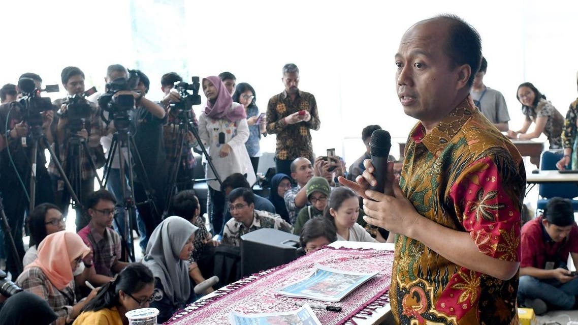 This photo taken on October 2, 2018 shows Indonesia's disaster agency spokesman Sutopo Purwo Nugroho (R) addressing the media during a press conference in Jakarta on the latest updates following the powerful earthquake and tsunami. (AFP)