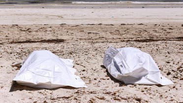 This picture taken on July 6, 2019 on the beach of Aghir in Tunisia's southern island of Djerba shows recovered bodies from a boat carrying 86 migrants that capsized off the Tunisian coast while crossing the Mediterranean from Libya to Italy. The latest tragedy came to light the same week as 44 migrants were killed in an air strike on their detention centre in a suburb of the Libyan capital. (AFP)