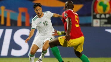Algeria’s Adam Ounas in action with Guinea’s Ernest Seka  in the Africa Cup of Nations 2019 Round of 16 on July 7, 2019. (Reuters)