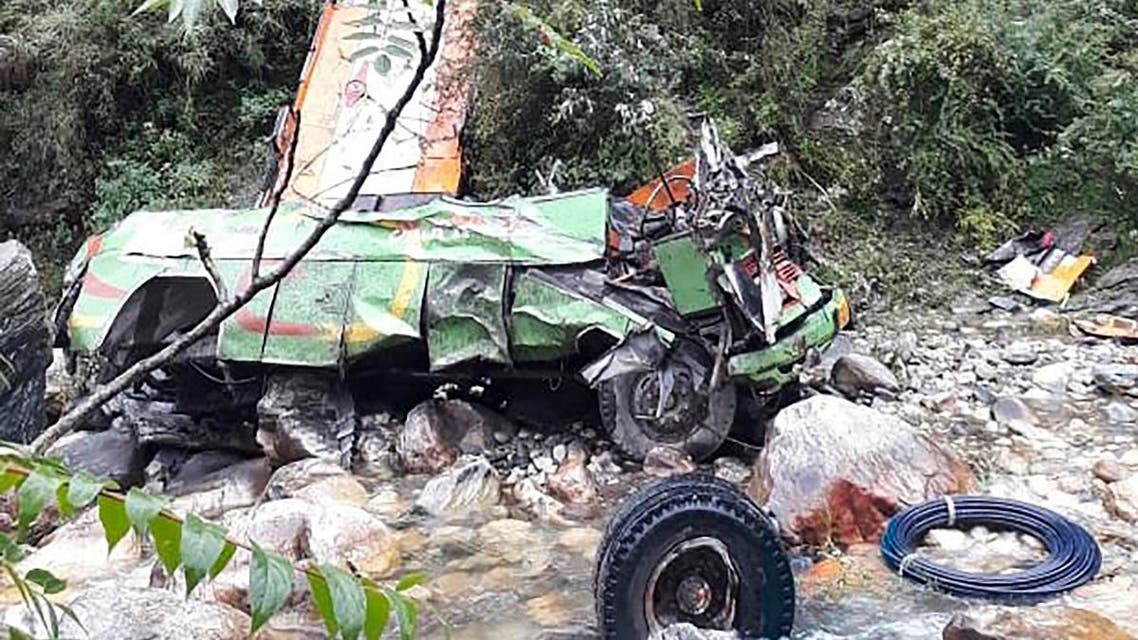 The remains of a bus carrying some 50 passengers are seen after it fell into a 150-metre (500-foot) gorge near Banjar, in the mountainous Kullu district of the Indian state of Himachal Pradesh on June 20, 2019. (AFP)
