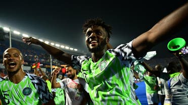Nigeria's defender Chidozie Awaziem (R) celebrates the win during the 2019 Africa Cup of Nations (CAN) quarter final football match between Nigeria and South Africa at Cairo international stadium. (AFP)