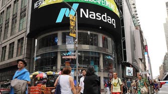 Nasdaq ends at record as Fed chief signals possible rate cut