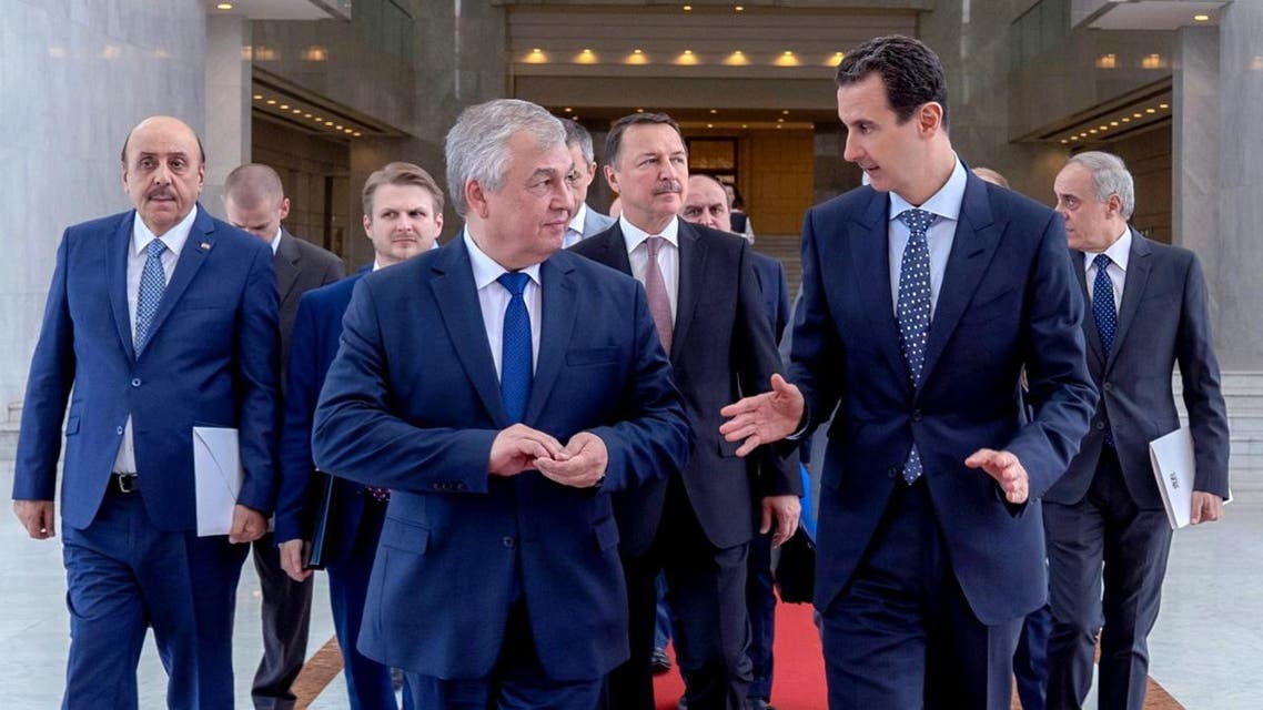 Syrian president Bashar al-Assad (R) meets with Russia’s special envoy on Syria Alexander Lavrentiev in Damascus on July 12, 2019. (AFP)