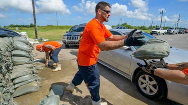 St. Bernard Parish Sheriff’s Office inmate workers move free sandbags for residents in Chalmette, La., Thursday, July 11, 2019, ahead of ahead of Tropical Storm Barry from the Gulf of Mexico. (AP)