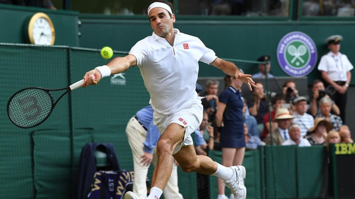 Roger Federer returns against Rafael Nadal during their men’s singles semi-final match on day 11 of the 2019 Wimbledon Championships at The All England Lawn Tennis Club in Wimbledon, southwest London, on July 12, 2019. (AFP)