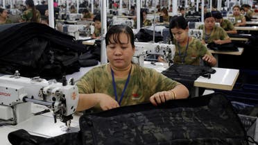 Workers assemble products at a factory owned by Yakeda Outdoor Travel Products Co. LTD in Yangon, Myanmar, on June 11, 2019. (Reuters)