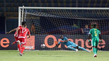 Senegal’s Alfred Gomis saves the penalty of Tunisia’s Ferjani Sassi  in the Africa Cup of Nations 2019 semi-final match at the 30 June Stadium, Cairo, on July 14, 2019. (Reuters)