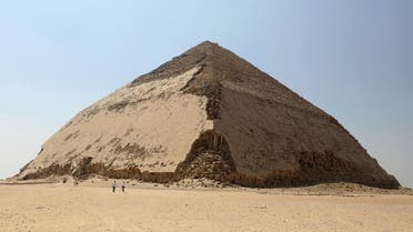 People walk in front of the Bent Pyramid of Sneferu, that was reopened after restoration work, in Dahshur, south of Cairo. (Reuters)