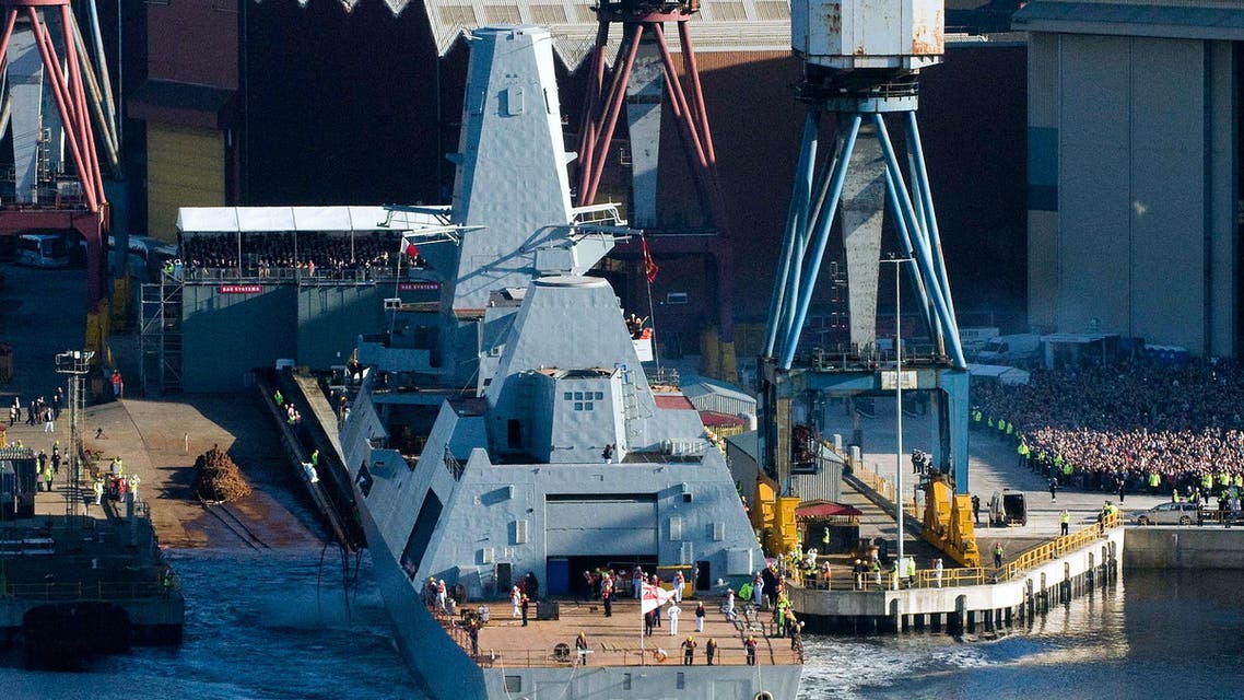 People watch as HMS Duncan, one of the Britain's Royal Navy’s new Type 45 Destroyers, is launched from Govan shipyard, in Glasgow, Scotland, on October 11, 2010. HMS Duncan is the sixth Type 45 Destroyer, or 'D' Class vessel that has been commissioned by the Navy, and is named after Admiral Adam Duncan, the 1st Viscount Duncan of Camperdown, who defeated the Dutch fleet off Camperdown on 11th October 1797. AFP PHOTO / DEREK BLAIR