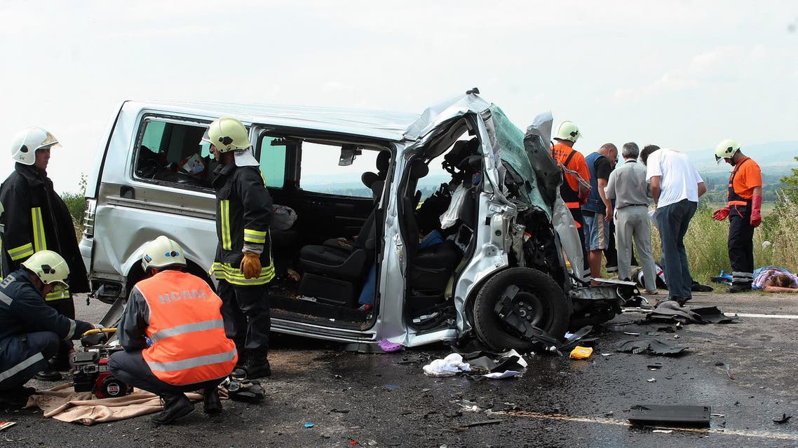File photo of Rescue workers work next to crashed Turkish minibus near the town of Lyubimets on July 4, 2009. (AFP)